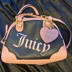 New juicy couture purse black and pink leather purse .